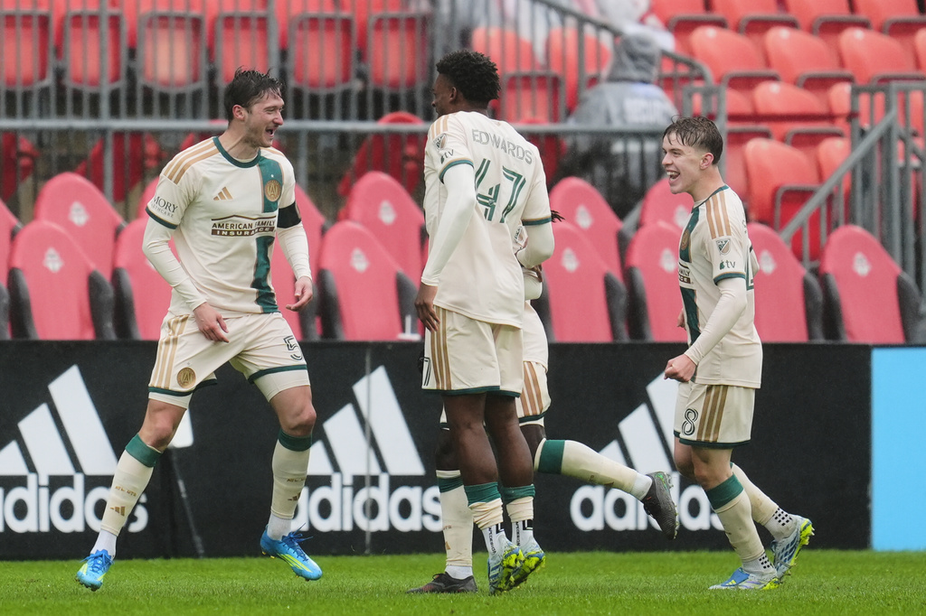 Atlanta United's Alexey Miranchuk, left, celebrates with teammates after scoring a goal against Toronto FC during the second half of an MLS soccer game in Toronto, Saturday, April 25, 2026. (Frank Gunn/The Canadian Press via AP)