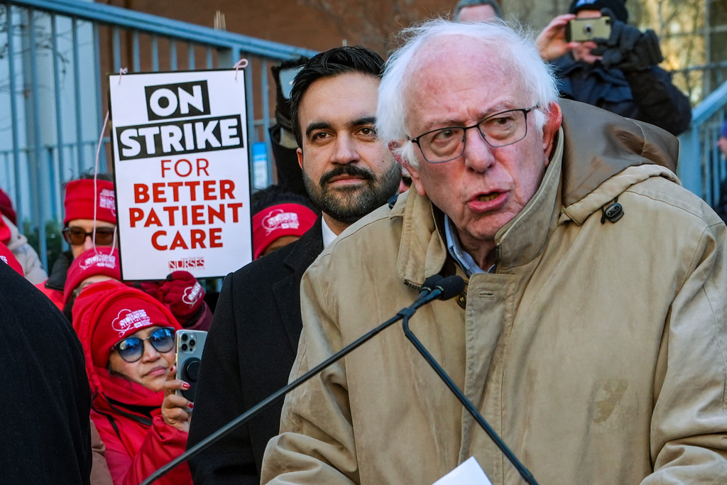 Mayor Zohran Mamdani and Senator Bernie Sanders (I-VT), speak in front of members of the New York State Nurses Association union during a picket outside Mount Sinai West Hospital, Tuesday, Jan. 20, 2026, in New York. (AP Photo/Ryan Murphy)
