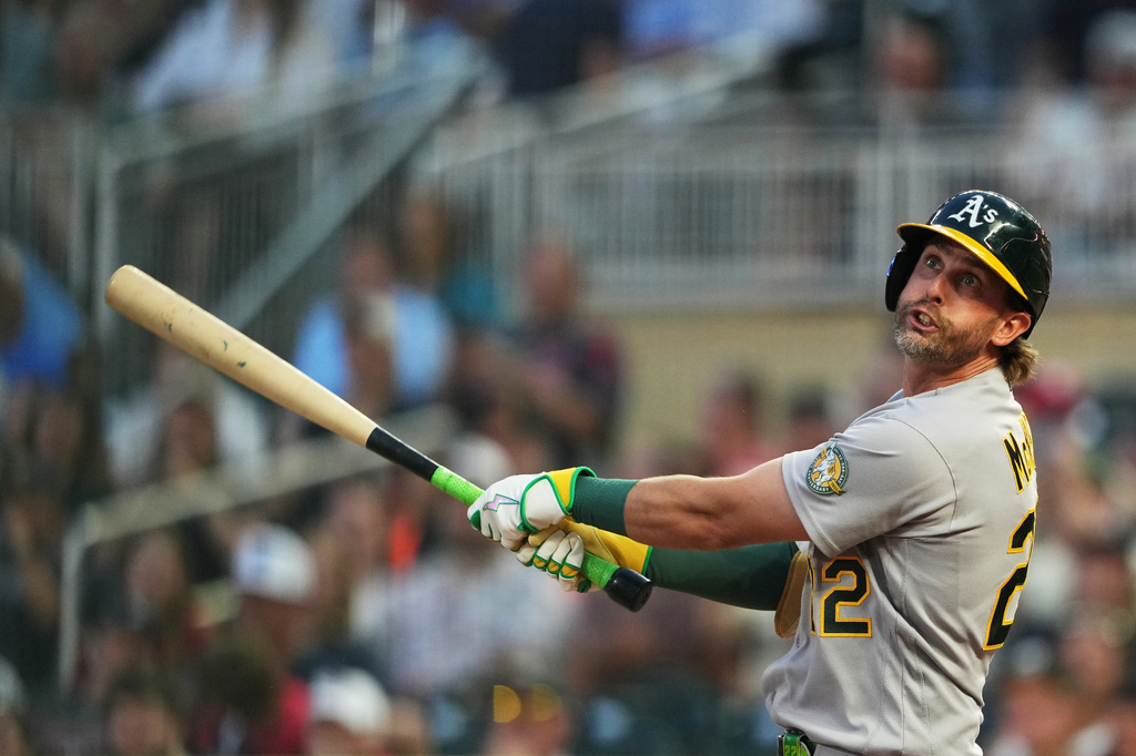 Athletics' Jeff McNeil bats against the Minnesota Twins during the fifth inning of a baseball game, Friday, July 24, 2026, in Minneapolis. (AP Photo/Ellen Schmidt)