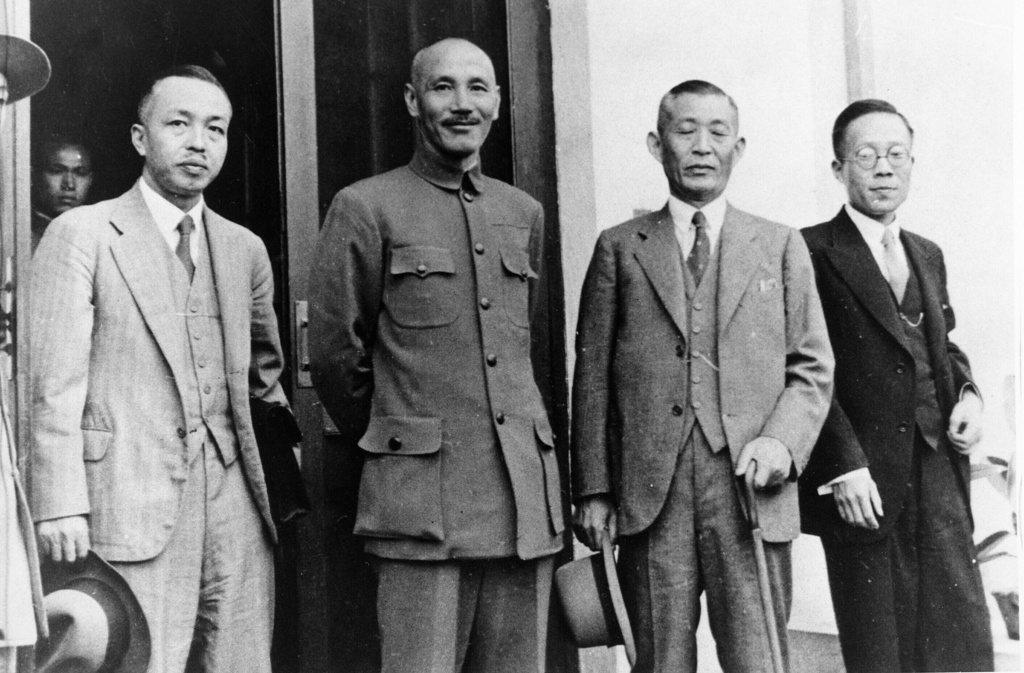 FILE - Gen. Chiang Kai-shek, China's Head of Republic, center in uniform, and Shigero Kawagoye, Japanese Ambassador to China, are photographed in Nanking, China, on Nov. 5, 1936. They are participating in the historic conference to settle acute relations between Japan and China. They are flanked by their secretaries. (AP Photo, File)
