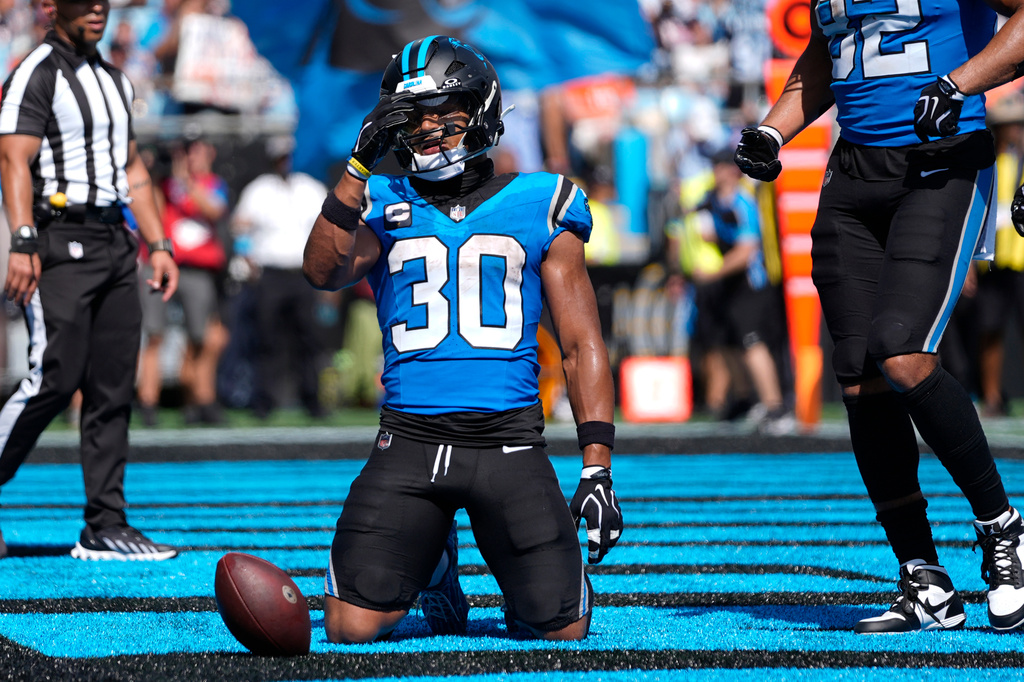 Carolina Panthers running back Chuba Hubbard (30) celebrates after scoring a touchdown during the second half of an NFL football game, Sunday, Sept. 13, 2026, in Charlotte, N.C. (AP Photo/Erik Verduzco)