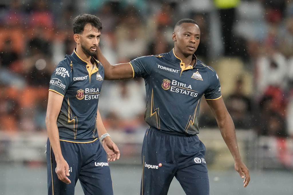 Gujarat Titans' Prasidh Krishna celebrates with Kagiso Rabada the wicket of Punjab Kings' Shashank Singh during the Indian Premier League cricket match between Gujarat Titans and Punjab Kings in New Chandigarh, India, Tuesday, March 31, 2026. (AP Photo/Ashwini Bhatia)