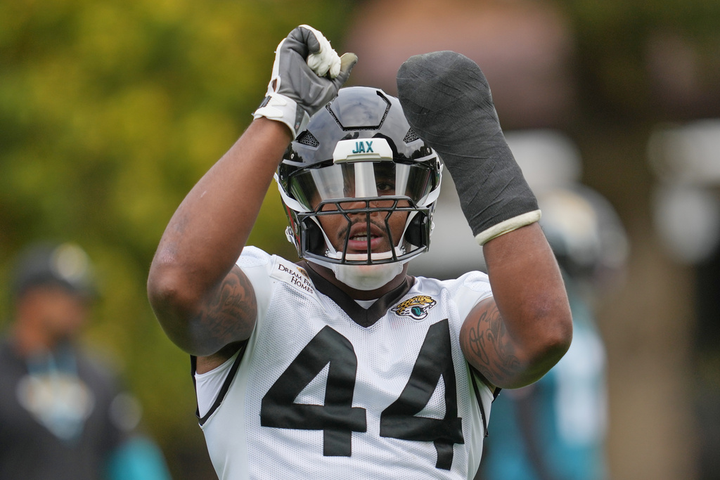 Jacksonville Jaguars defensive end Travon Walker (44), works out during an NFL football practice at The Grove in Watford, England, Friday, Oct. 17, 2025. (AP Photo/Kin Cheung)
