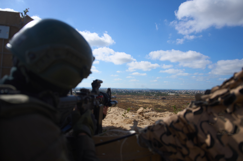 An Israeli soldier occupies a military position overlooking the so-called yellow line in the central Gaza Strip, Tuesday, May 26, 2026. (AP Photo/Ariel Schalit)