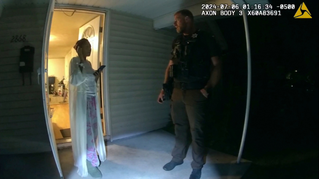 FILE - In this image from body camera video released by Illinois State Police, Sonya Massey, left, talks with Sangamon County Sheriff's Deputy Sean Grayson outside her home in Springfield, Ill., July 6, 2024. (Illinois State Police via AP, File)