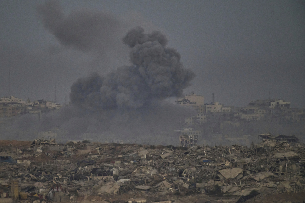 Smoke rises to the sky following an Israeli military strike in the northern Gaza Strip, as seen from southern Israel, Saturday, Sept. 20, 2025. (AP Photo/Leo Correa)