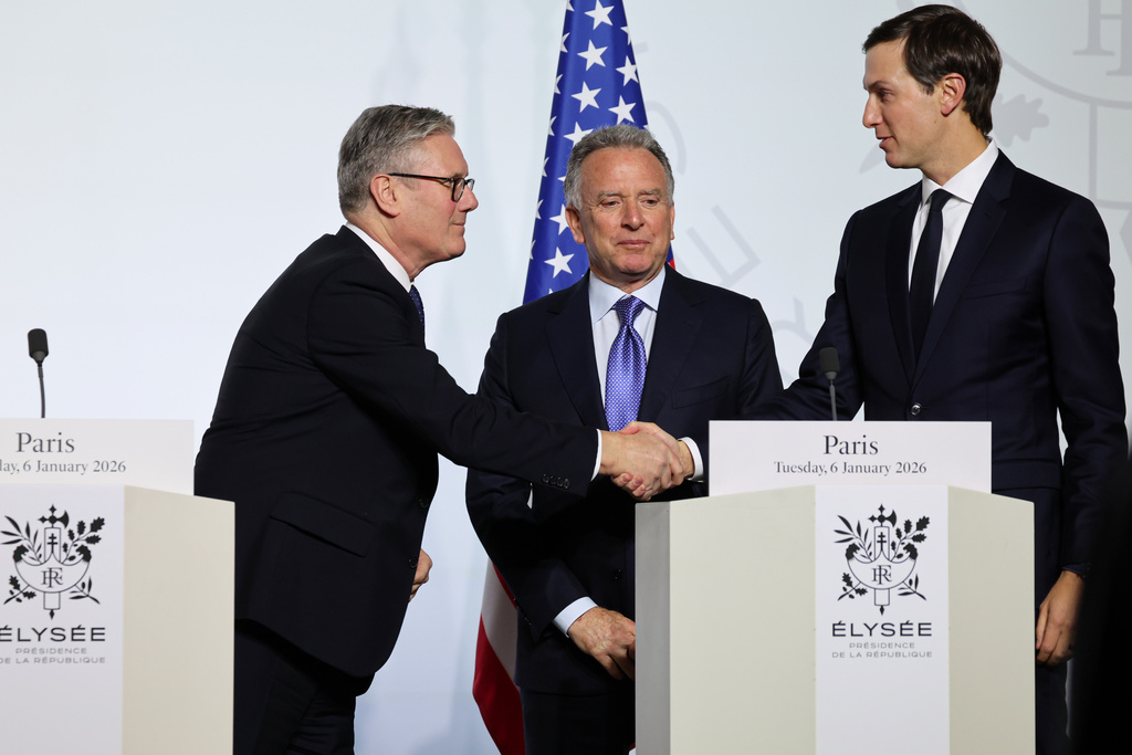 Britain's Prime Minister Keir Starmer, left, shakes hands with US businessman Jared Kushner flanked by US Envoy Steve Witkoff, center, after the signing of the declaration on deploying post-ceasefire force in Ukraine during the 'Coalition of the Willing' summit on security guarantees for Ukraine, at the Elysee Palace in Paris, Tuesday, Jan 6, 2026. (Ludovic Marin, Pool photo via AP)