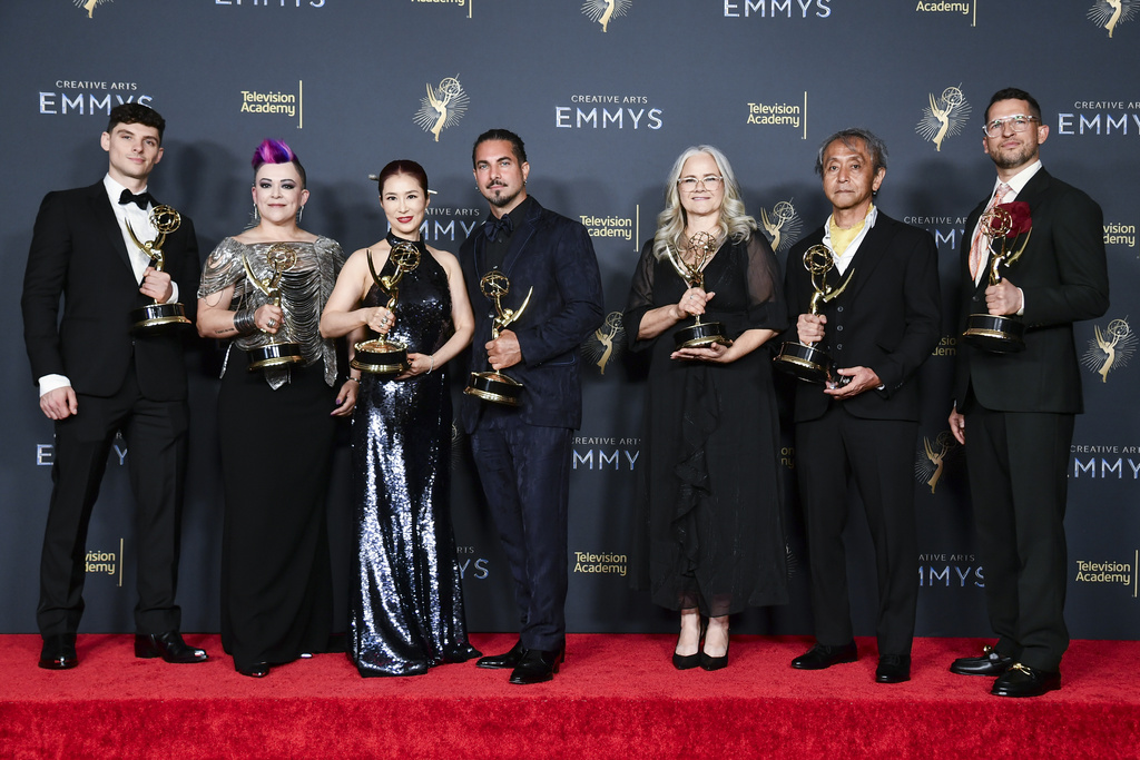 CORRECTS YEAR - Michael Fontaine, from left, Crystal Jurado, Diana Choi, Mike Marino, Claire Flewin, Yoichi Art Sakamoto, and Bobby Diehl pose in the press room with the award for outstanding prosthetic makeup for "The Penguin" during night one of the Creative Arts Emmy Awards on Saturday, Sept. 6, 2025, in Los Angeles. (Photo by Richard Shotwell/Invision/AP)