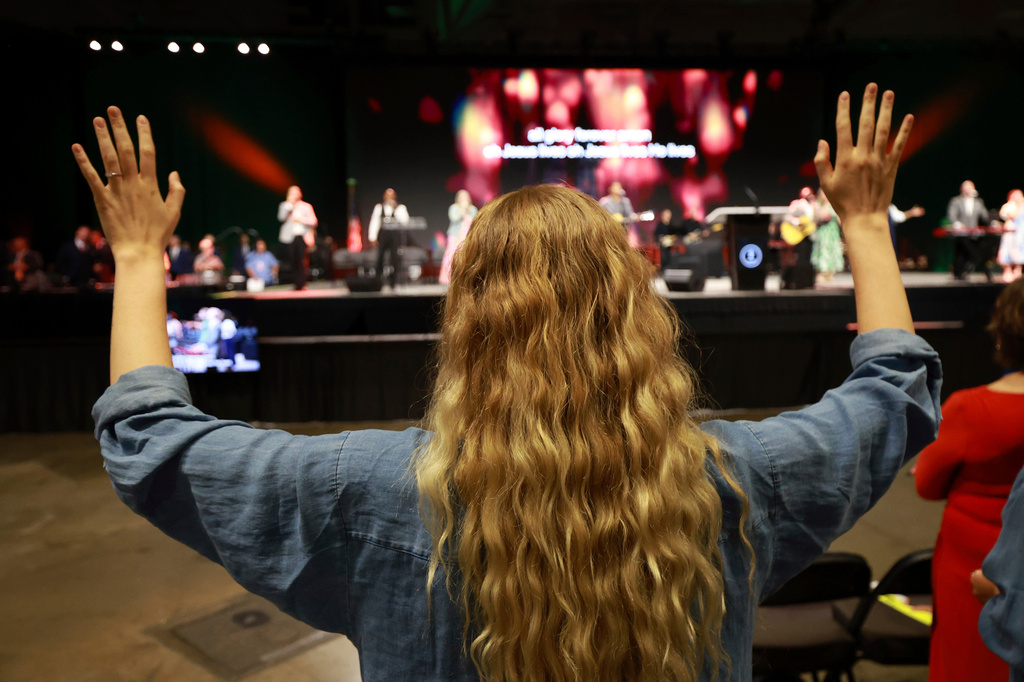 FILE - A messenger attending the Southern Baptist Convention participates in worship during the 2025 SBC Annual Meeting, June 10, 2025, in Dallas. (AP Photo/Richard W. Rodriguez, File)