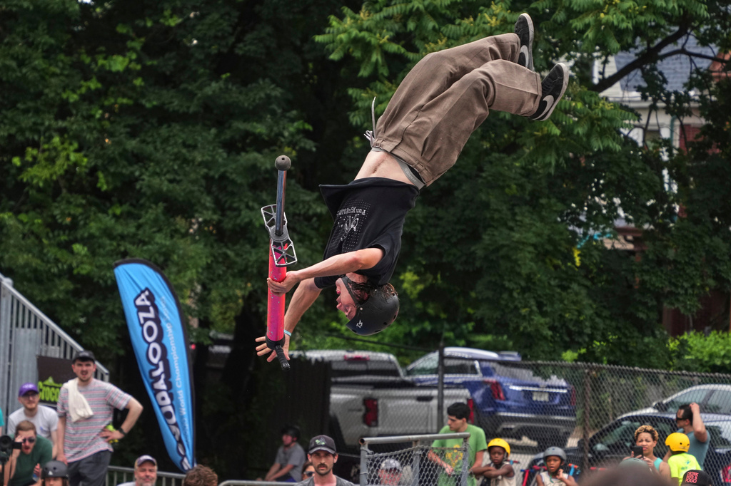 Extreme pogo athlete Henry Cabelus competes in the Best Trick competition during Pogopalooza 2026 in Wilkinsburg, Pa., Sunday, June 14, 2026. (AP Photo/Gene J. Puskar)