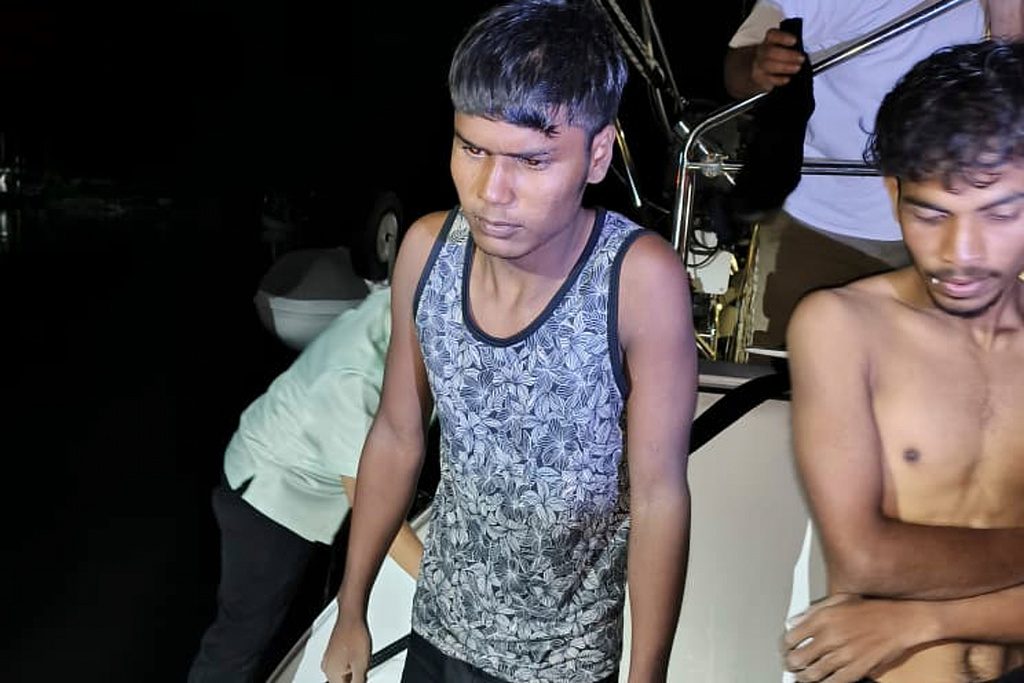 This photo released by Malaysian Maritime Enforcement Agency shows migrants handed over to authorities after they were rescued by a sailboat, in waters off northern resort island of Langkawi, Malaysia, Saturday, Nov. 8, 2025. (Malaysian Maritime Enforcement Agency via AP)