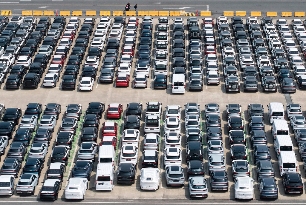 FILE - Aerial view of new vehicles waiting for shipment to overseas market at a port in Shanghai, China, May 9, 2026. (Chinatopix via AP, File)