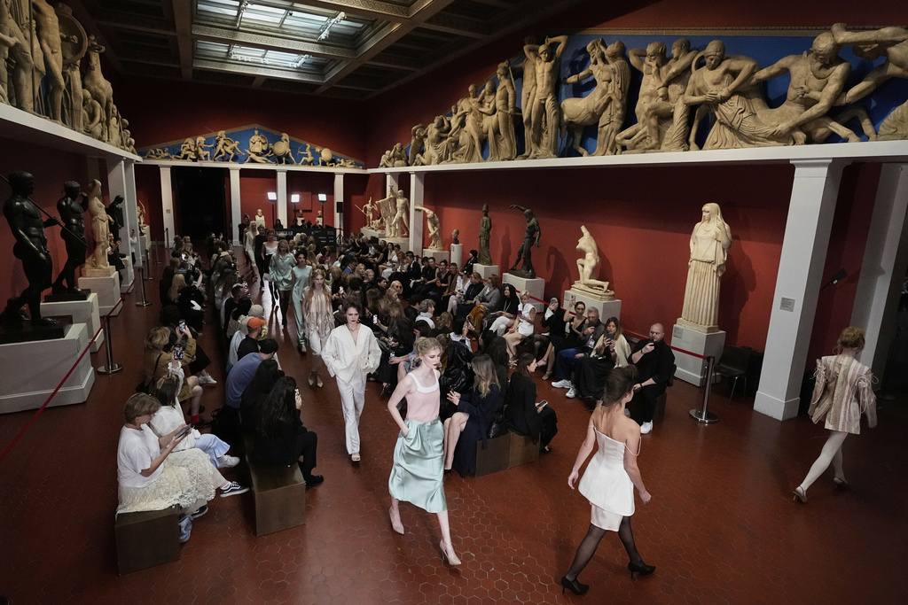 Models wear creations by Russian brand Soroka On Course on a runway at the ancient Greek art hall of the Pushkin State Museum of Fine Arts during the Moscow Fashion Week in Moscow, Russia, Monday, Sept. 1, 2025. (AP Photo/Pavel Bednyakov)