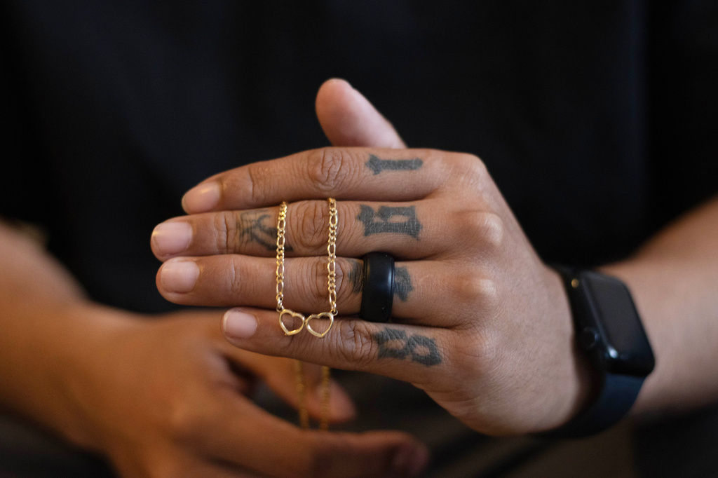 Army Sgt. Hedar Leonel Turcios Juarez, whose wife Cristy has been detained by immigration authorities, holds a necklace he gave to her at home in El Paso, Texas, July 21, 2026. (AP Photo/Ryan Romero)