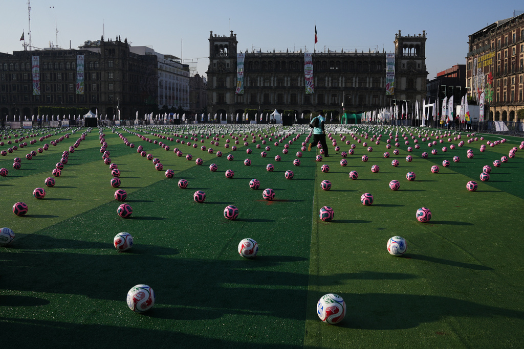Soccer balls sit ahead of an event to set a Guinness World Record for the "largest soccer class" at the Zocalo in Mexico City, Sunday, March 15, 2026. (AP Photo/Marco Ugarte)