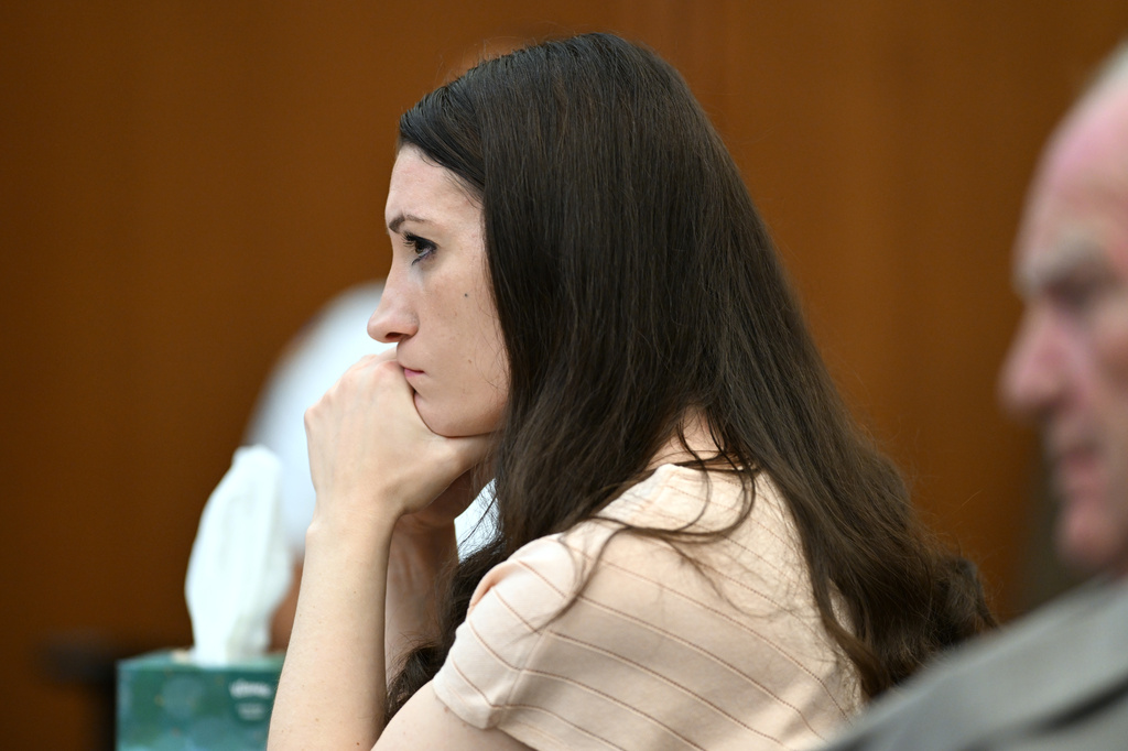 Lindsay Clancy, center, and her lawyer Kevin Reddington, right, listen during testimony during Clancy's murder trial, Thursday, Aug. 13, 2026., in Plymouth, Mass. (AP Photo/Josh Reynolds, Pool)