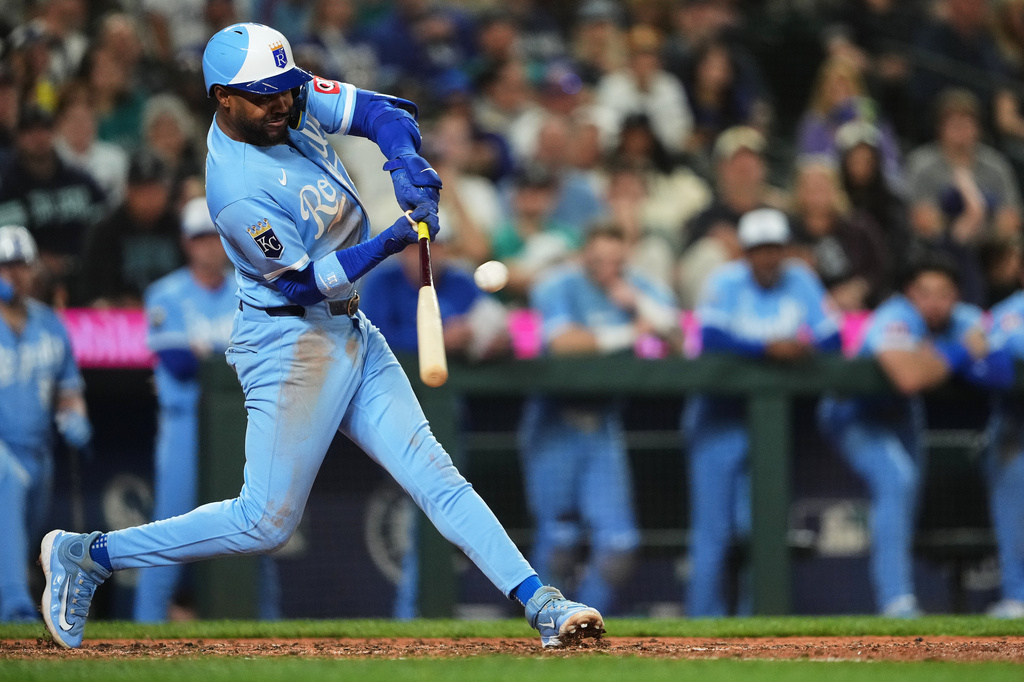 Kansas City Royals' Maikel Garcia hits an RBI sacrifice fly against the Seattle Mariners during the 10th inning of a baseball game, Saturday, May 2, 2026, in Seattle. (AP Photo/Lindsey Wasson)