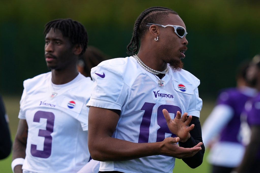 Minnesota Vikings wide receiver Justin Jefferson (18), right, and Minnesota Vikings wide receiver Jordan Addison (3) warm up during a training session ahead of their match against Pittsburgh Steelers in Dublin, Friday, Sept. 26, 2025.(AP Photo/Frank Augstein)