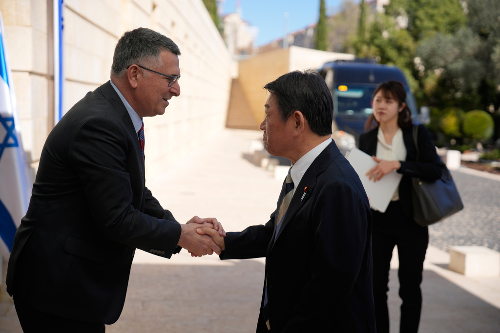 Israel's Foreign Minister Gideon Sa'ar, left, meets with Japan's Foreign Minister Toshimitsu Motegi in Jerusalem, Sunday, Jan. 11, 2026. (AP Photo/Ohad Zwigenberg)