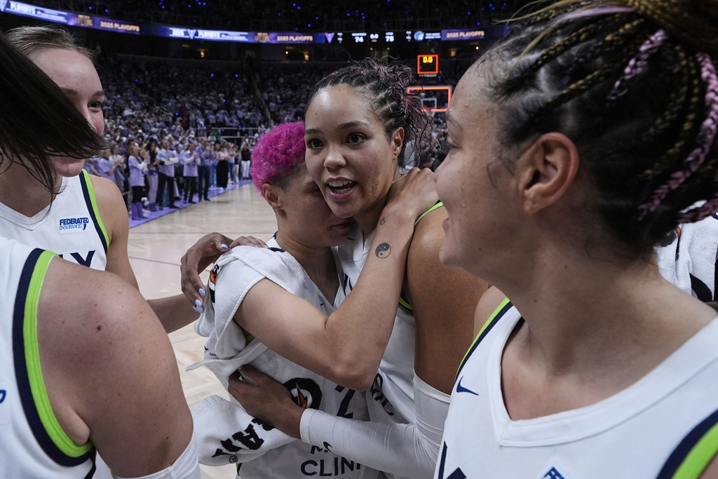 Minnesota Lynx's Napheesa Collier, center right, celebrates with Natisha Hiedeman after the team's victory over the Golden State Valkyries in Game 2 in the first round of the WNBA basketball playoffs Wednesday, Sept. 17, 2025, in San Jose, Calif. (AP Photo/Godofredo A. Vásquez)
