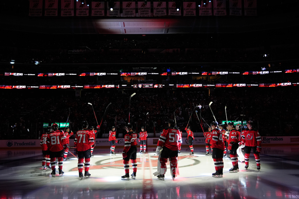 The New Jersey Devils are introduced before their home opener NHL hockey game against the Florida Panthers Thursday, Oct. 16, 2025, in Newark, N.J. (AP Photo/Seth Wenig)
