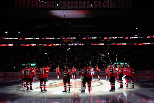 The New Jersey Devils are introduced before their home opener NHL hockey game against the Florida Panthers Thursday, Oct. 16, 2025, in Newark, N.J. (AP Photo/Seth Wenig) The New Jersey Devils are introduced before their home opener NHL hockey game against the Florida Panthers Thursday, Oct. 16, 2025, in Newark, N.J. (AP Photo/Seth Wenig)