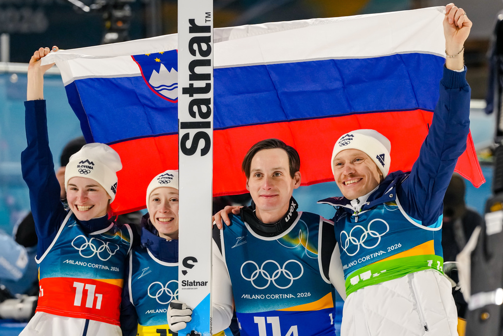Nika Vodan, from left, Nika Prevc, Domen Prevc, and Anze Lanisek, of Slovenia, pose after winning the gold medal in the ski jumping mixed team competition at the 2026 Winter Olympics, in Predazzo, Italy, Tuesday, Feb. 10, 2026. (AP Photo/Kirsty Wigglesworth)