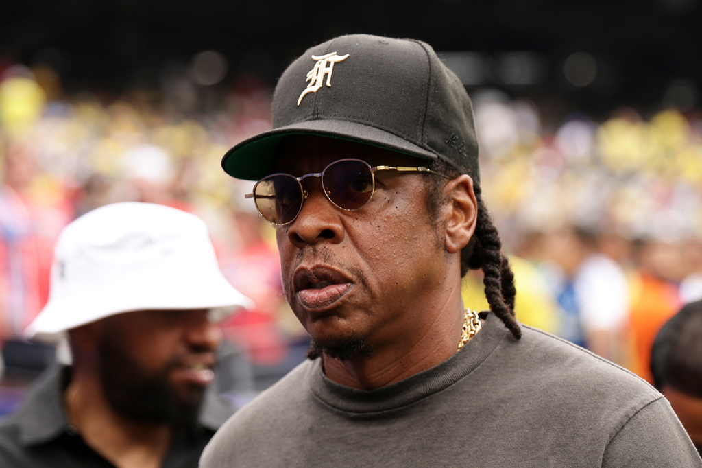 Jay-Z looks on ahead of the start the World Cup round of 16 soccer match between Brazil and Norway in East Rutherford, N.J., near New York, Sunday, July 5, 2026. (AP Photo/Adam Hunger)