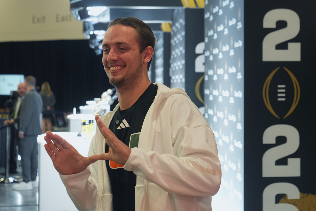 Miami quarterback Carson Beck poses during media day ahead of the College Football Playoff national championship game between Miami and Indiana, Sunday, Jan. 17, 2027, in Miami. The game will be played on Monday. (AP Photo/Marta Lavandier)