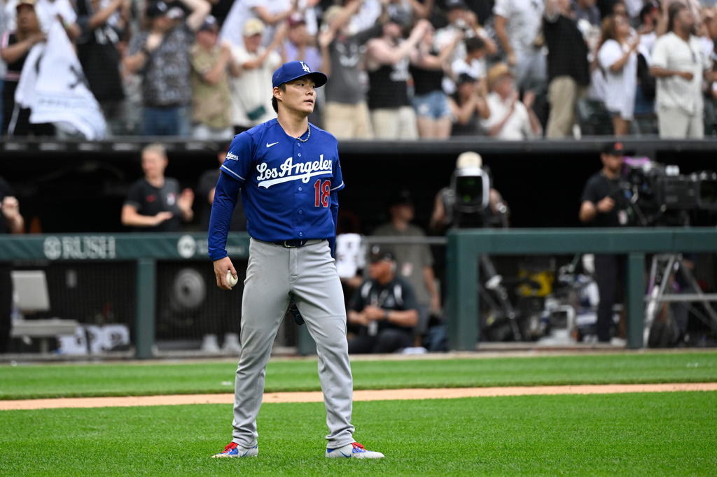 Los Angeles Dodgers pitcher Yoshinobu Yamamoto of Japan, looks on after Chicago White Sox' Tristan Peters hit a home run during the ninth inning of a baseball game, Saturday, June 13, 2026, in Chicago. (AP Photo/Matt Marton)
