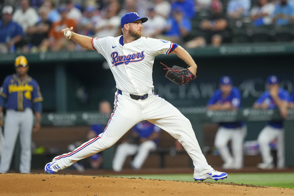 Texas Rangers starting pitcher Merrill Kelly throws against the Milwaukee Brewers during the third inning of a baseball game Wednesday, Sept. 10, 2025, in Arlington, Texas. (AP Photo/Julio Cortez)