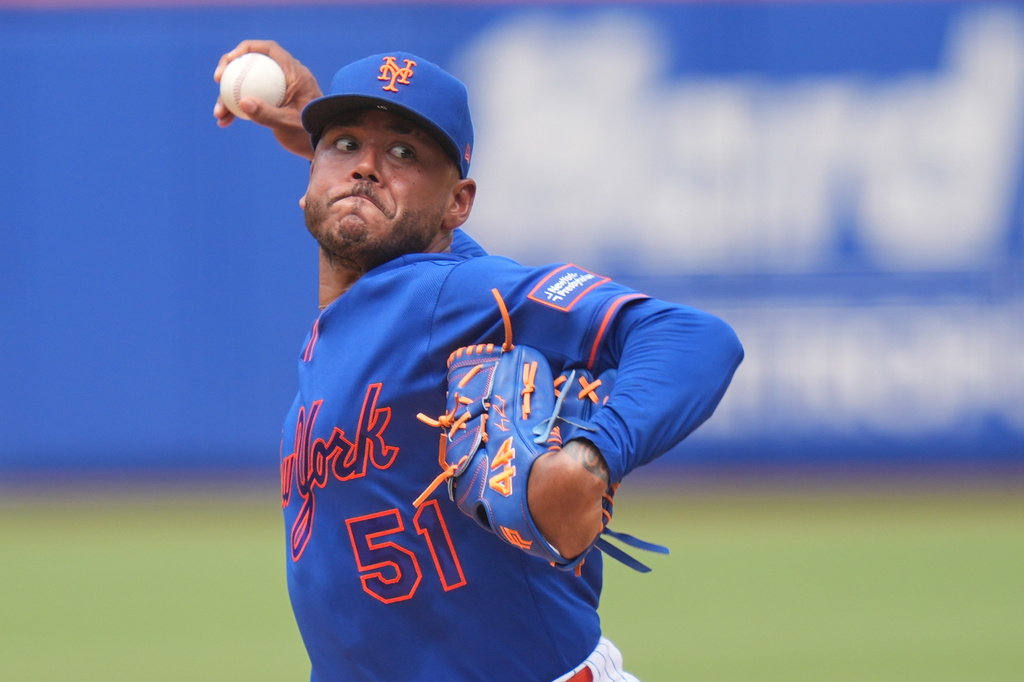 New York Mets pitcher Freddy Peralta throws during the second inning of a baseball game against the Atlanta Braves, Sunday, June 14, 2026, in New York. (AP Photo/Seth Wenig)