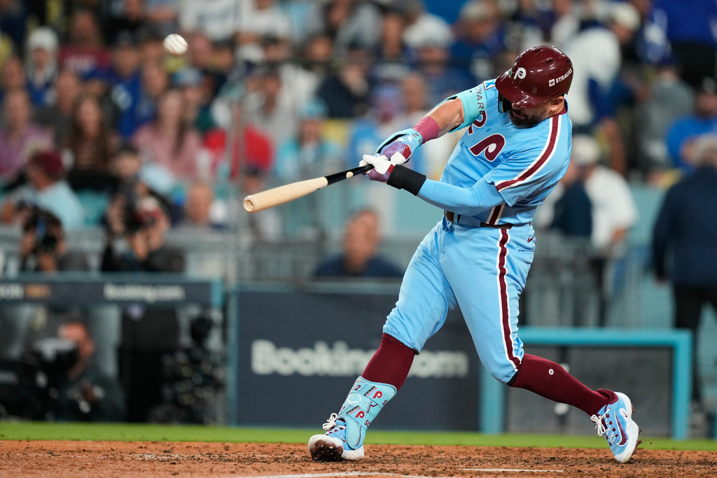 Philadelphia Phillies' Kyle Schwarber connects for a two-run home run during the eighth inning in Game 3 of baseball's National League Division Series against the Los Angeles Dodgers, Wednesday, Oct. 8, 2025, in Los Angeles. (AP Photo/Mark J. Terrill)