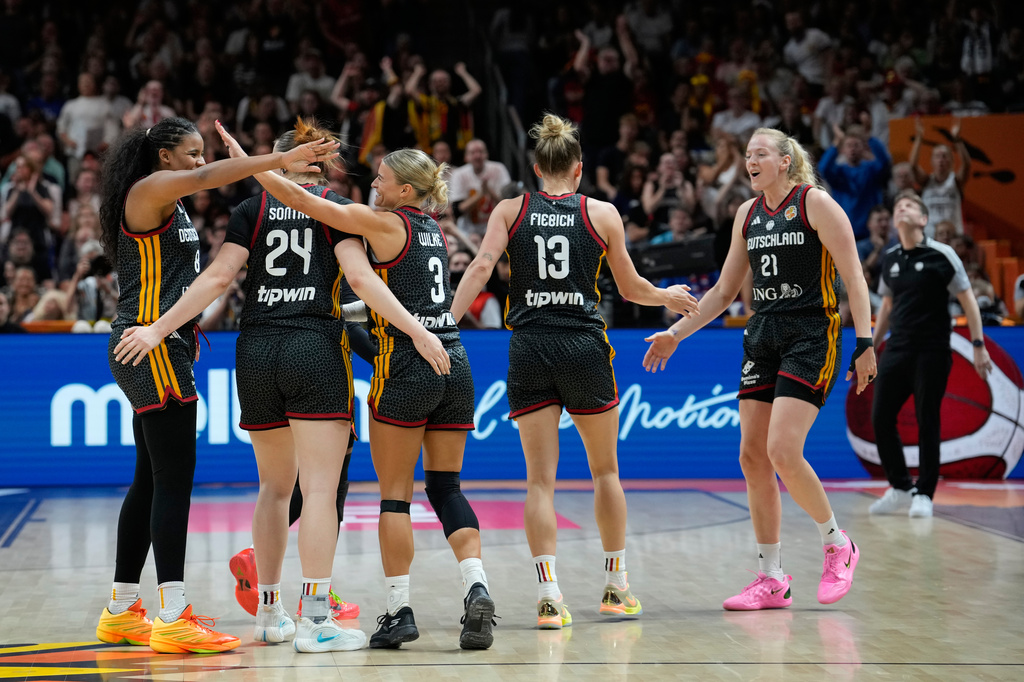 German players react during the Women's Basketball World Cup quarterfinal match between Germany and Belgium in Berlin, Thursday, Sept. 10, 2026. (AP Photo/Ebrahim Noroozi)