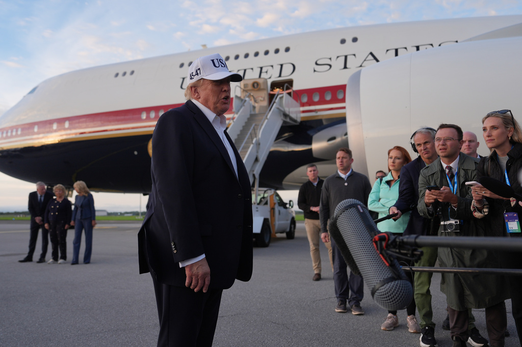 U.S. President Donald Trump speaks with journalists prior to boarding Air Force One at Shannon Airport in Shannon, Ireland, Sunday, Sept. 13, 2026. (AP Photo/Julia Demaree Nikhinson)