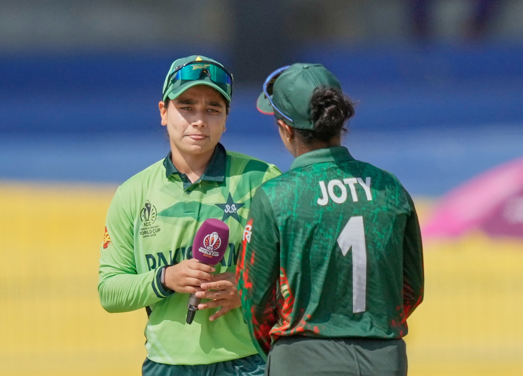 Pakistan's captain Fatima Sana, left, chats with Bangladesh's captain Nigar Sultana Joty before the ICC Women's Cricket World Cup match between Bangladesh and Pakistan in Colombo, Sri Lanka, Thursday, Oct. 2, 2025.(AP Photo/Eranga Jayawardena)