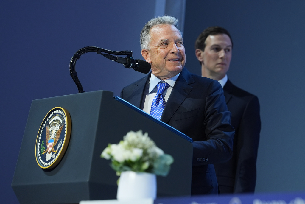 United States Mideast envoy Steve Witkoff, left, and Jared Kushner address the audience after the signing of a Board of Peace charter during the Annual Meeting of the World Economic Forum in Davos, Switzerland, Thursday, Jan. 22, 2026. (AP Photo/Evan Vucci)