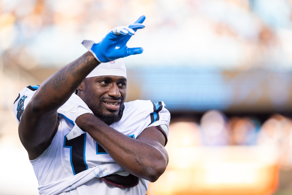 Carolina Panthers wide receiver Xavier Legette (17) waves to fans during the NFL football team's fan fest Friday, July 31, 2026, in Charlotte, N.C. (AP Photo/Scott Kinser)