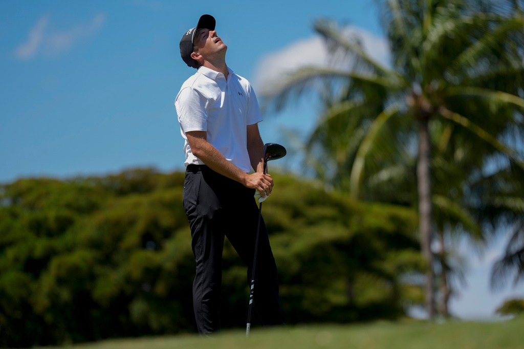 Jordan Spieth reacts to his shot from the eighth tee during the third round of the Cadillac Championship PGA golf tournament Saturday, May 2, 2026, in Doral, Fla. (AP Photo/David J. Phillip)