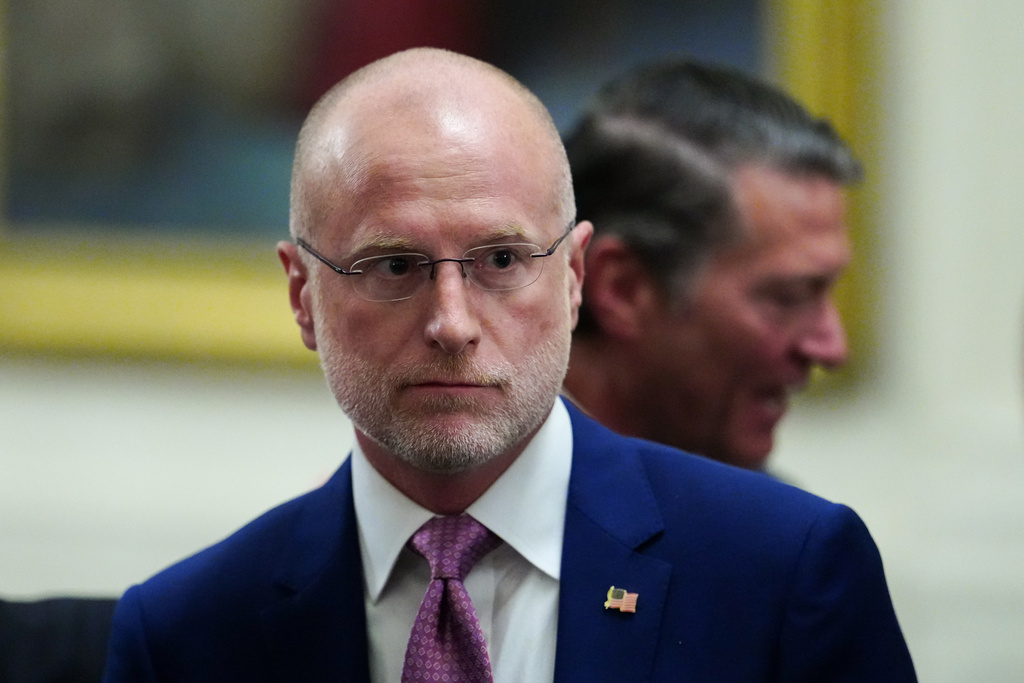 Federal Communications Commission (FCC) Chairman Brendan Carr departs the Commander-in-Chief's Trophy presentation with President Donald Trump and the Navy Midshipmen football team in the East Room of the White House, Friday, March 20, 2026, in Washington. (AP Photo/Julia Demaree Nikhinson)