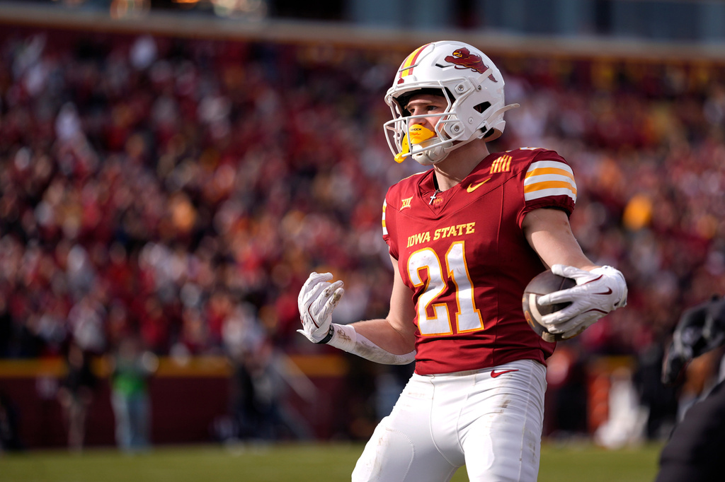 FILE - Iowa State running back Aiden Flora runs in a touchdown reception during the second half of an NCAA college football game against Kansas, Nov. 22, 2025, in Ames, Iowa. (AP Photo/Matthew Putney, File)