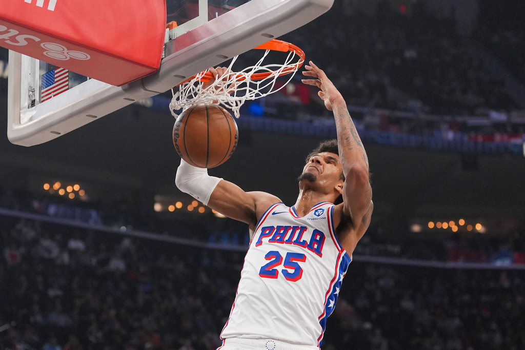 Philadelphia 76ers forward Dominick Barlow (25) makes a dunk during the first half of an NBA basketball game against the Los Angeles Clippers Monday, Feb. 2, 2026, in Inglewood, Calif. (AP Photo/Jae C. Hong)