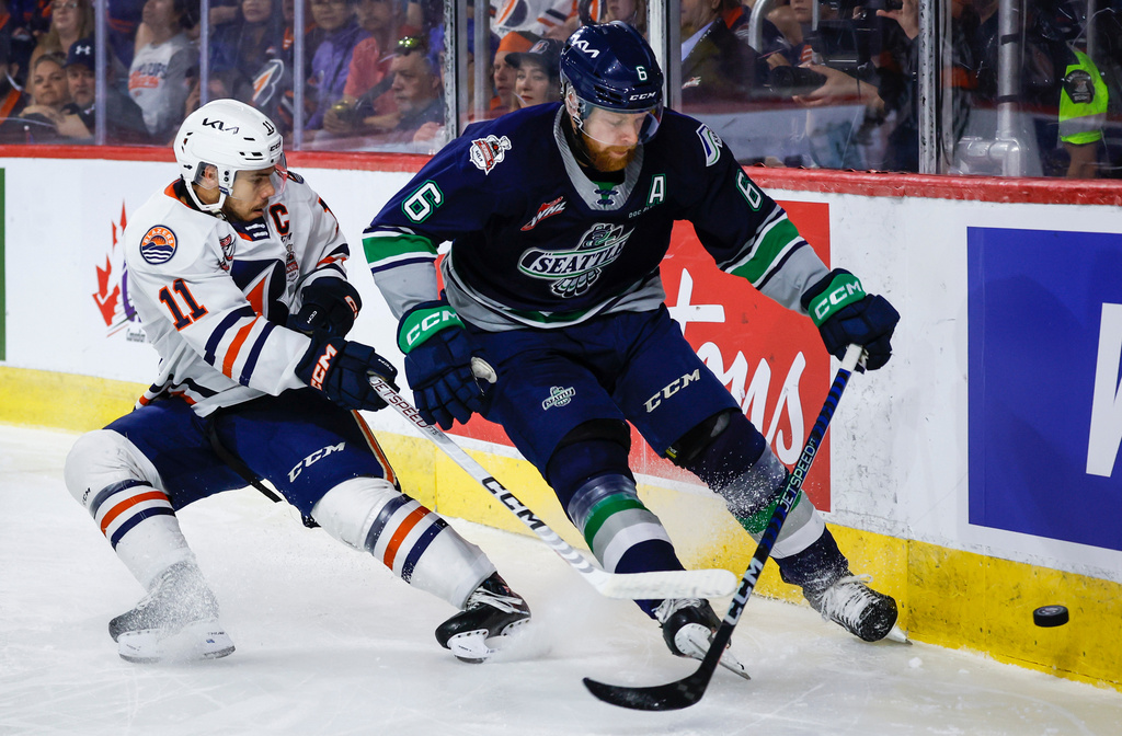 FILE - Seattle Thunderbirds defenseman Luke Prokop, right, is checked by Kamloops Blazers forward Logan Stankoven during the first period of a CHL Memorial Cup hockey game May 31, 2023, in Kamloops, British Columbia. (Jeff McIntosh/The Canadian Press via AP, File)