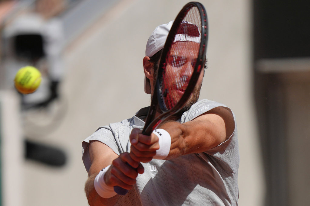 Karen Khachanov of Russia returns to Arthur Gea of France during the first round men's singles tennis match at the French Open tennis tournament in Paris, Sunday, May 24, 2026. (AP Photo/Aurelien Morissard)