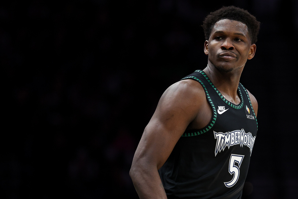 Minnesota Timberwolves guard Anthony Edwards reacts to his basket against the New York Knicks during the first half of an NBA basketball game Tuesday, Dec. 23, 2025, in Minneapolis. (AP Photo/Matt Krohn)