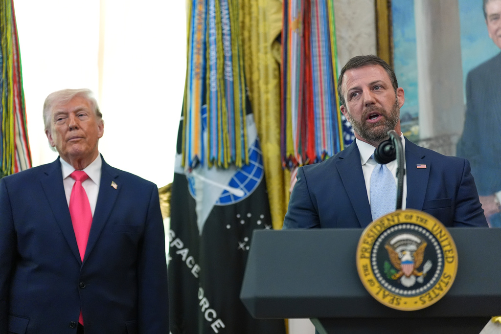 President Donald Trump listens as Homeland Security Secretary Markwayne Mullin during the swearing-in at the Oval Office of the White House, Tuesday, March 24, 2026, in Washington. (AP Photo/Alex Brandon)
