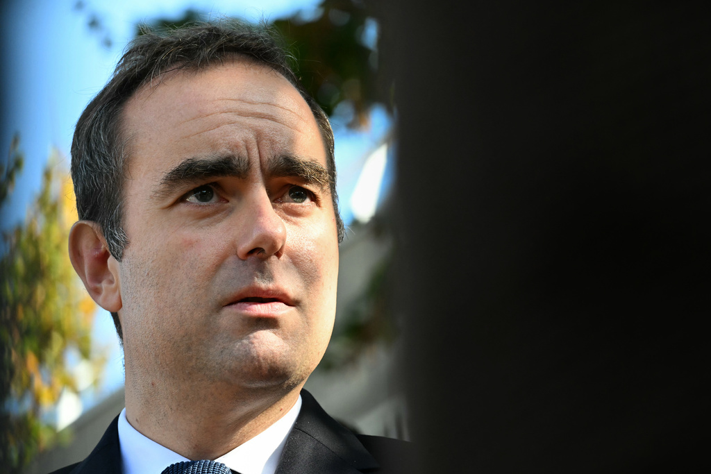 Reappointed French Prime Minister Sebastien Lecornu looks on as he visits a police station in L'Hay-les-Roses, outside Paris, Saturday, Oct. 11, 2025. (Martin Lelievre, Pool Photo via AP)