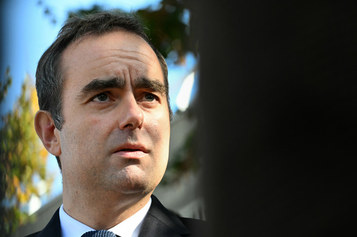 Reappointed French Prime Minister Sebastien Lecornu looks on as he visits a police station in L'Hay-les-Roses, outside Paris, Saturday, Oct. 11, 2025. (Martin Lelievre, Pool Photo via AP) Reappointed French Prime Minister Sebastien Lecornu looks on as he visits a police station in L'Hay-les-Roses, outside Paris, Saturday, Oct. 11, 2025. (Martin Lelievre, Pool Photo via AP)