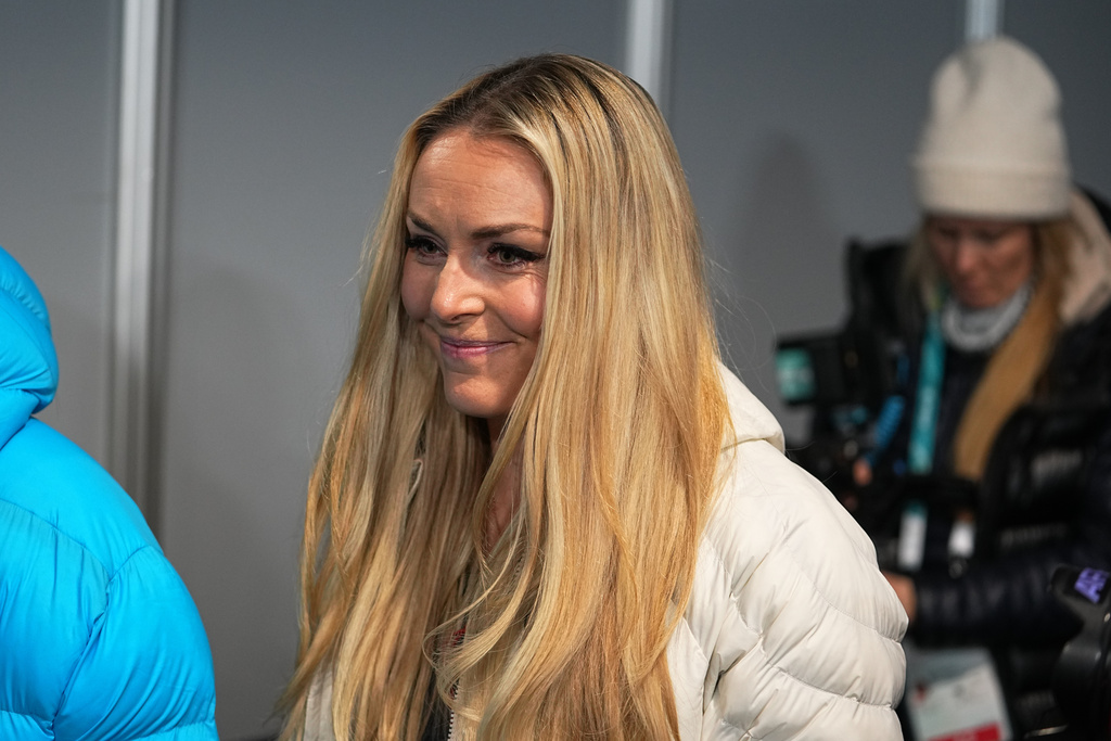 United States' Lindsey Vonn leaves after a press conference by the U.S. ski team at the 2026 Winter Olympics, in Cortina d'Ampezzo, Italy, Tuesday, Feb. 3, 2026. (AP Photo/Fatima Shbair)