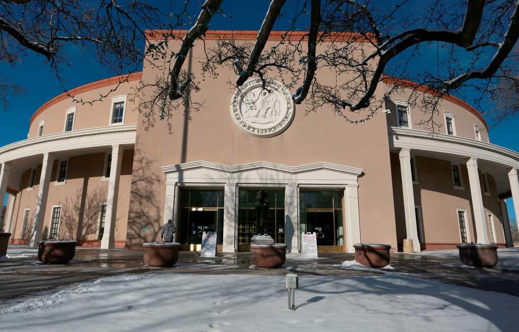 FILE - A janitor reports for work at the state Capitol rotunda during the annual legislative session Feb. 3, 2022, in Santa Fe, N.M. (AP Photo/Cedar Attanasio, File)